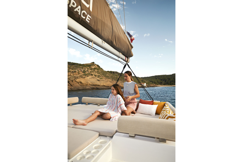 Mother and her daughter enjoying aboard a catamaran